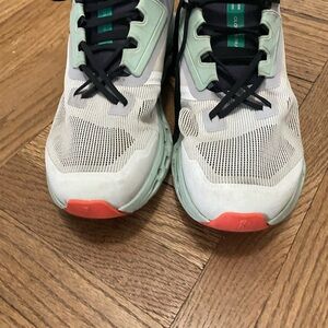 On Running Green and White with Orange Trim Cloudstratus Sneakers
